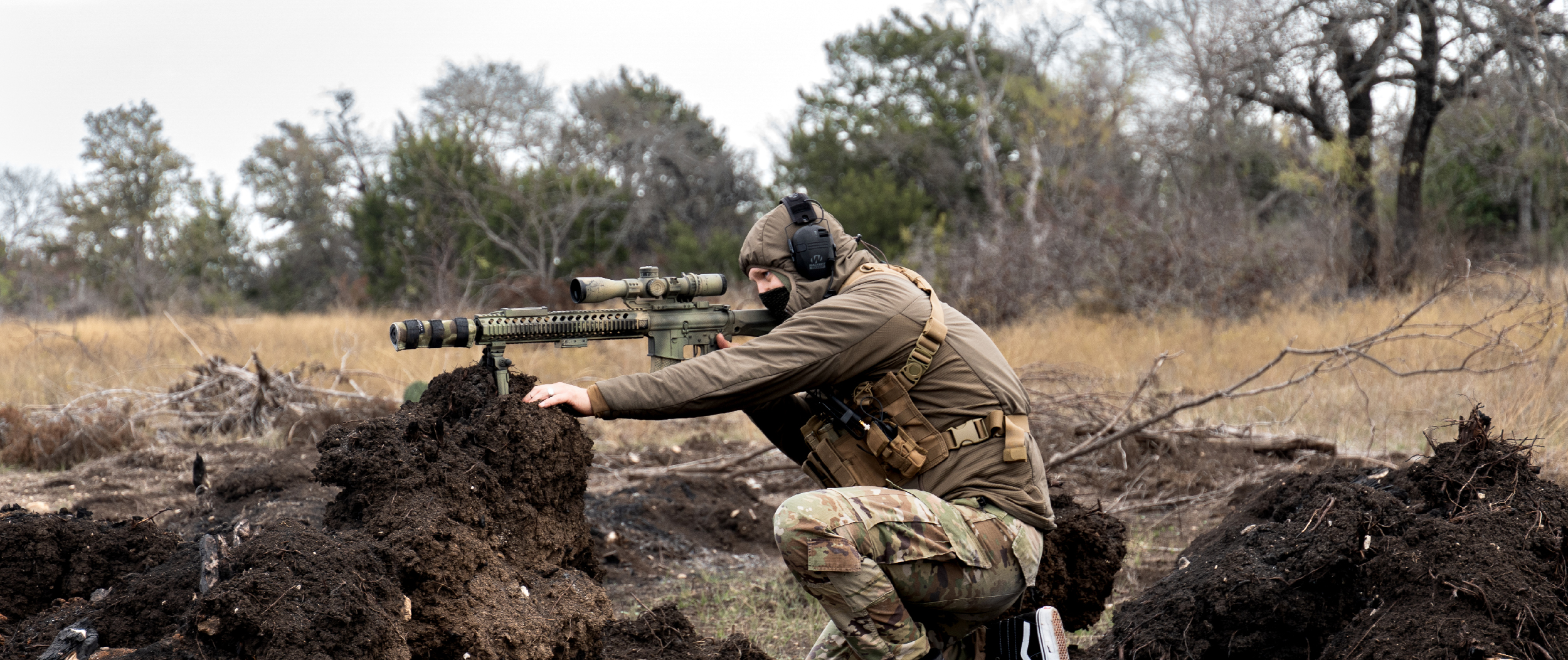 Image of someone using the HHR Pouch on a recon chest rig