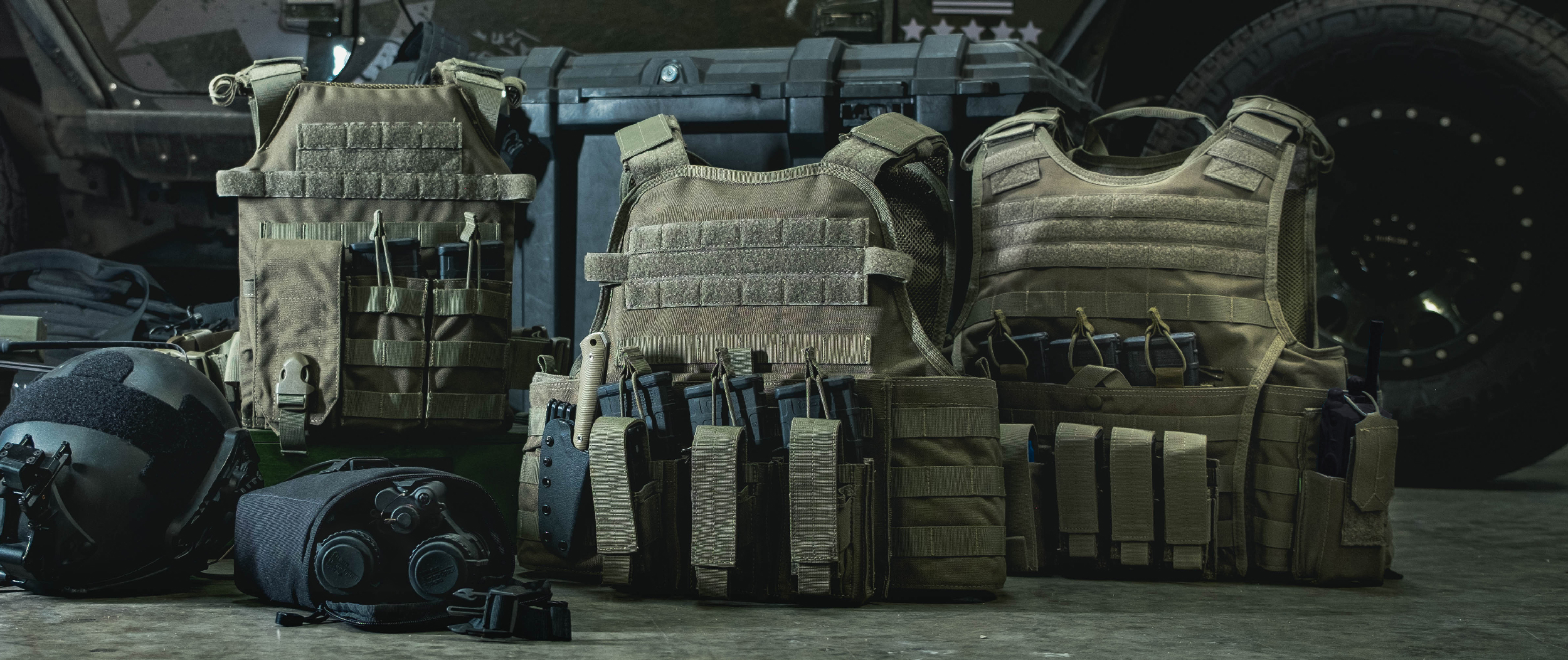Image of a few ranger green plate carriers where the mopc is at the center