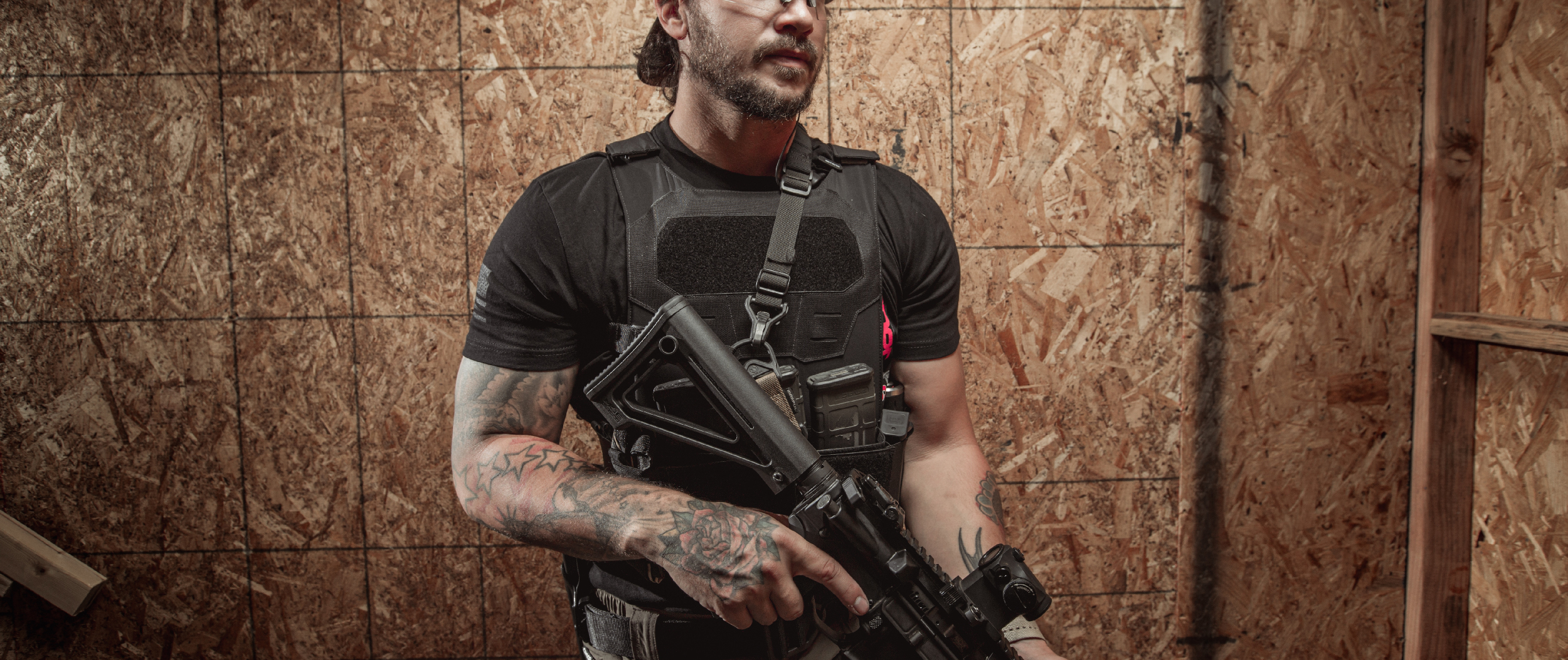 Image of a guy with an ar-15 wearing a specter minimalist plate carrier