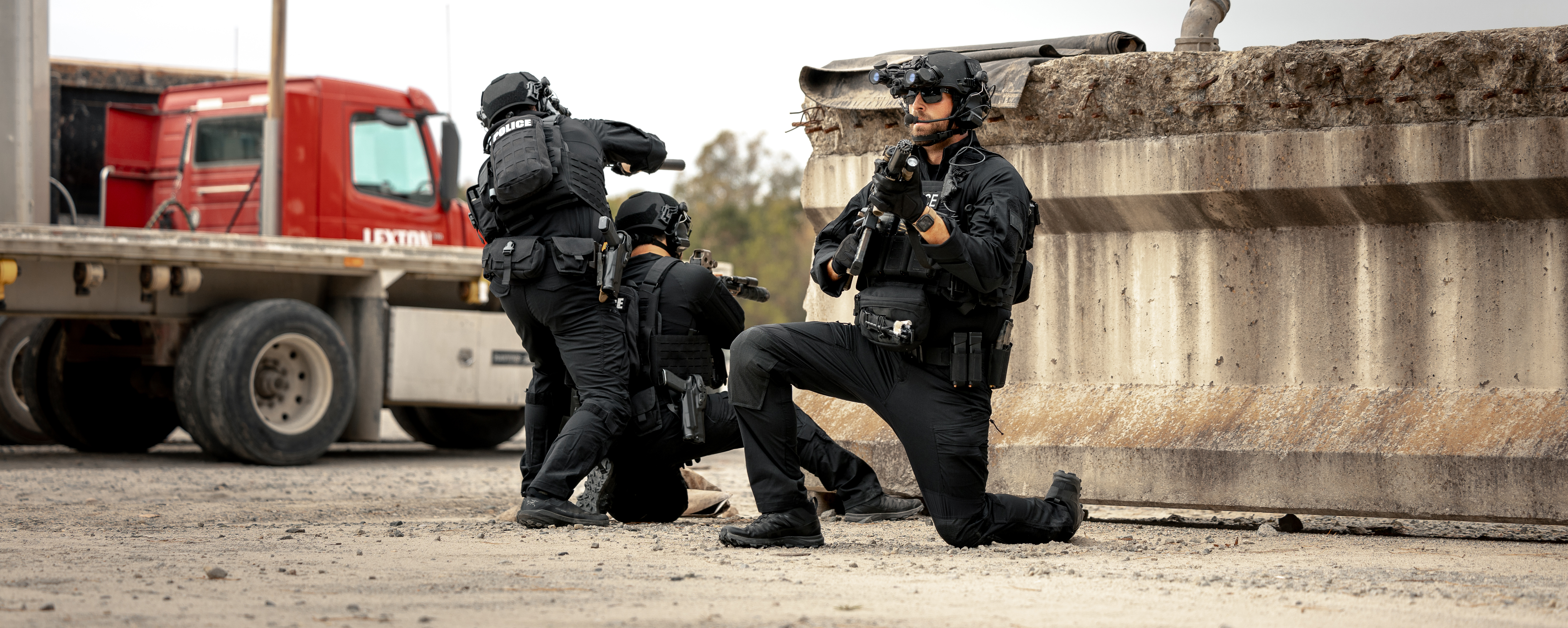 Image a group of elite police group walking in full kit, at the ready while wearing Paladin Tactical Pants